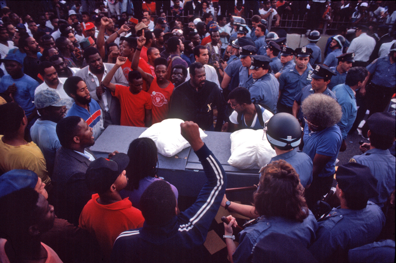 Demonstrators attempting to cross the Brooklyn Bridge with a symbolic coffin on the “Day Of Outrage,” August 31, 1989.